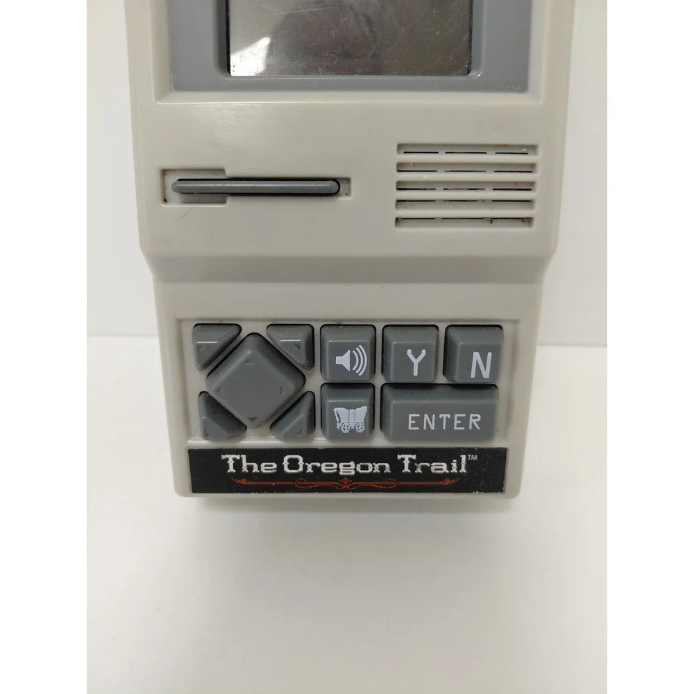 The Oregon Trail‎ Handheld Electronic Game Basic Fun 09597 Retro Travel Toy Grey